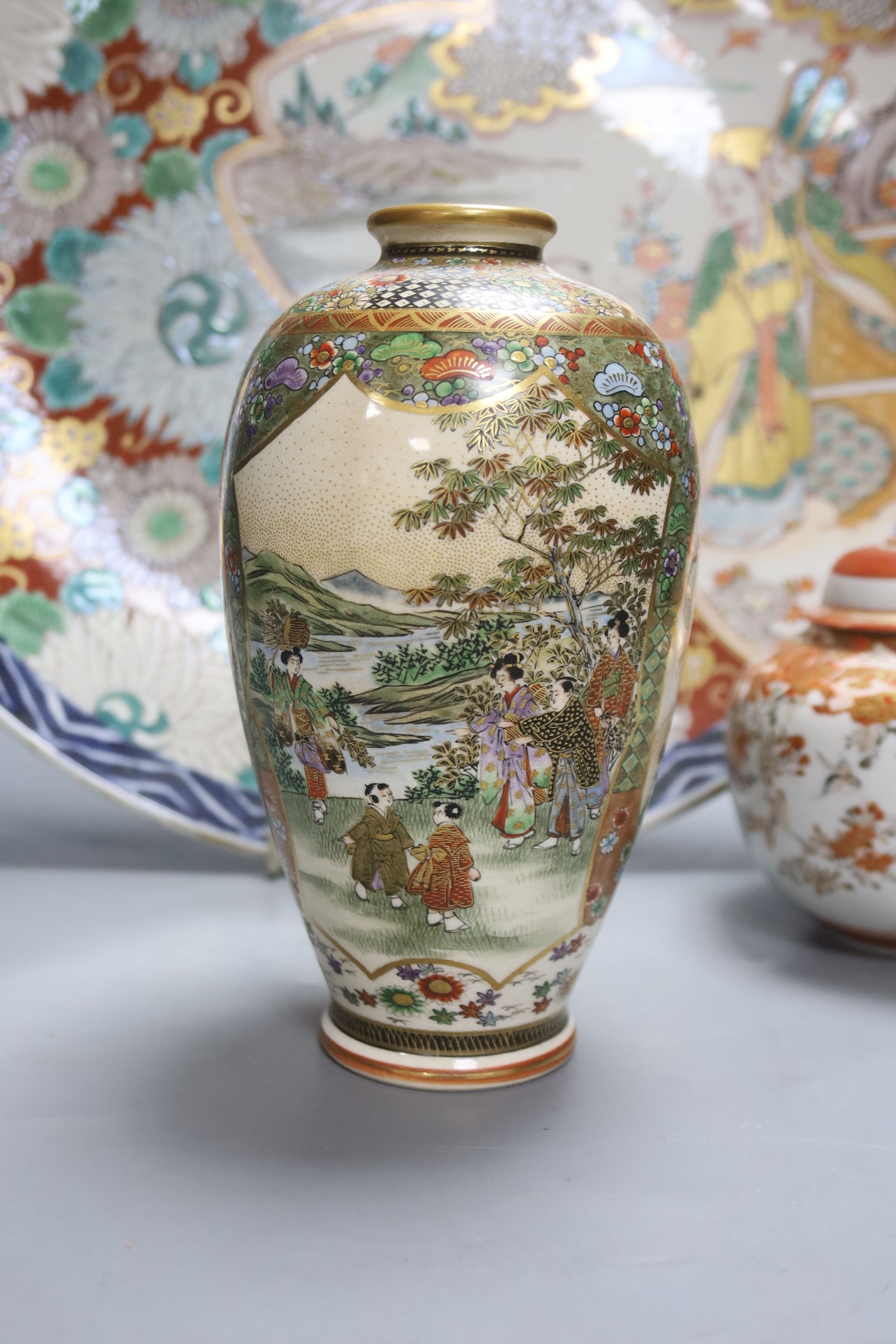 A Japanese Imari charger, a Kutani jar and cover and a Satsuma vase, diameter 40cm